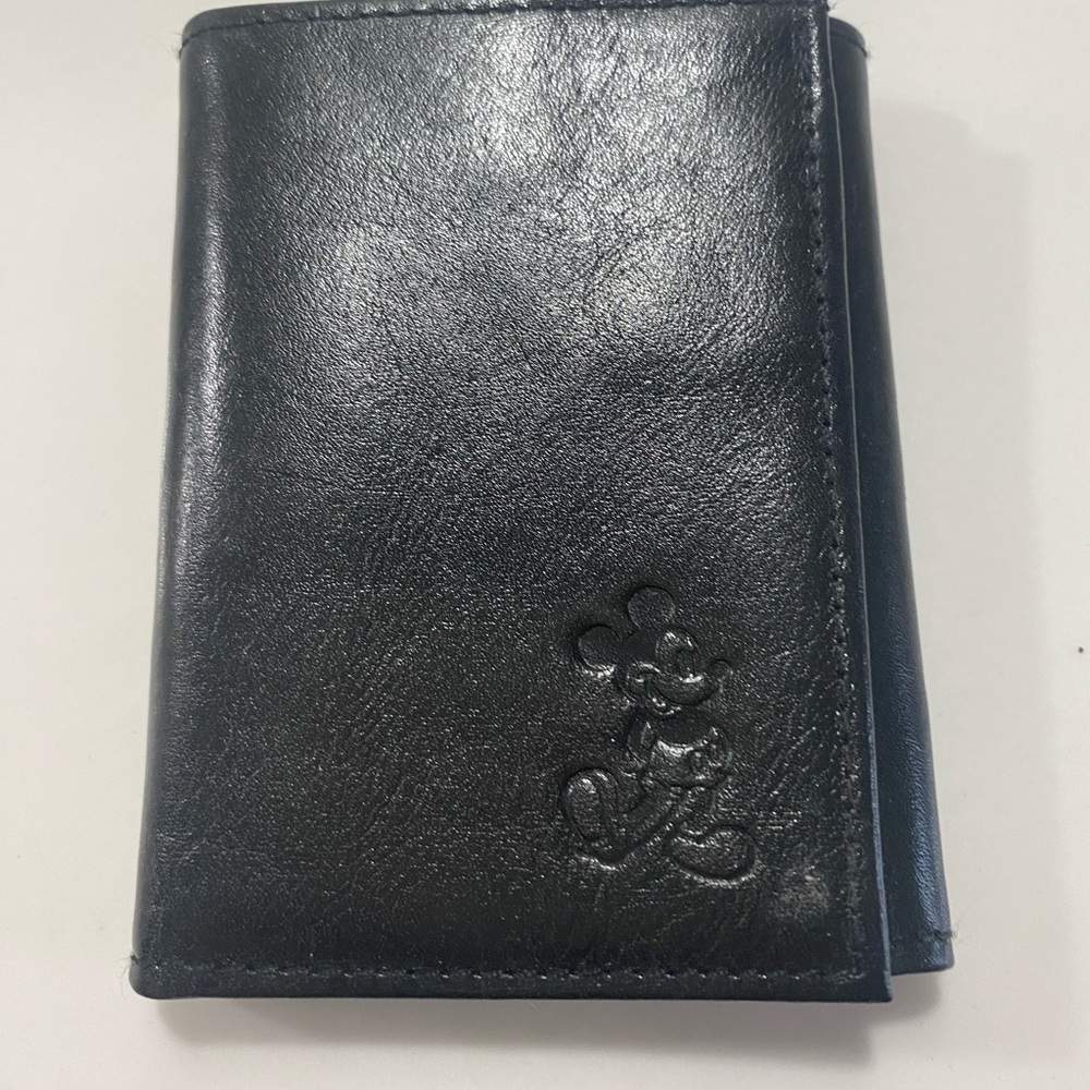 Walt Disney Co. top grain black genuine leather tri fold wallet. NWOT